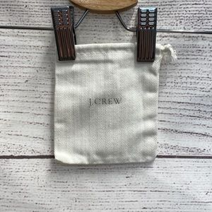 Small cream cloth J. Crew cloth jewelry dust bag 4" x 5" silver lettering